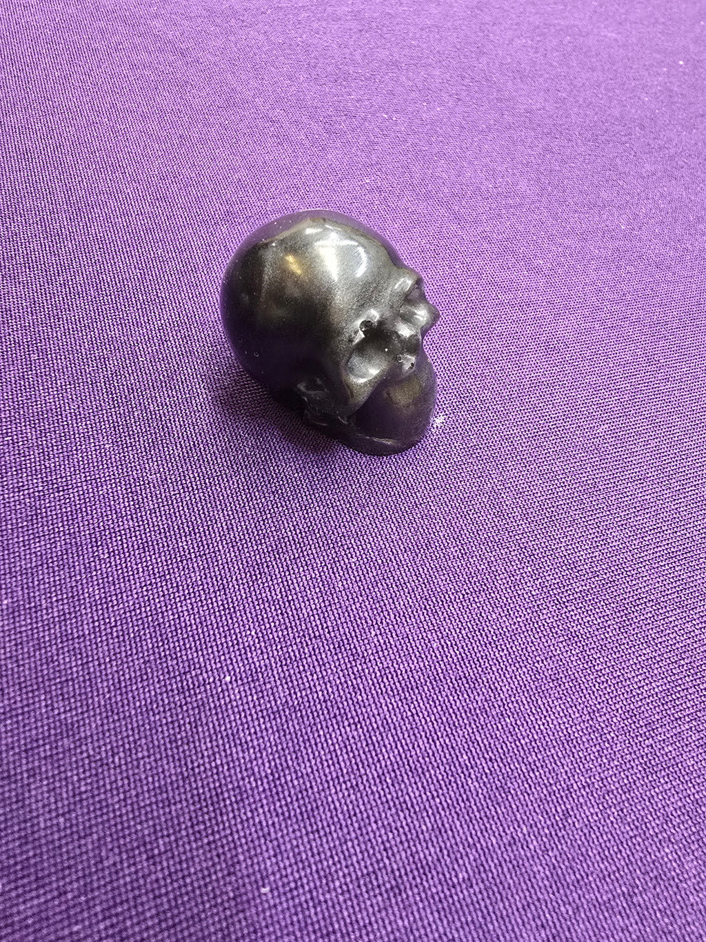 Skull-charm sized